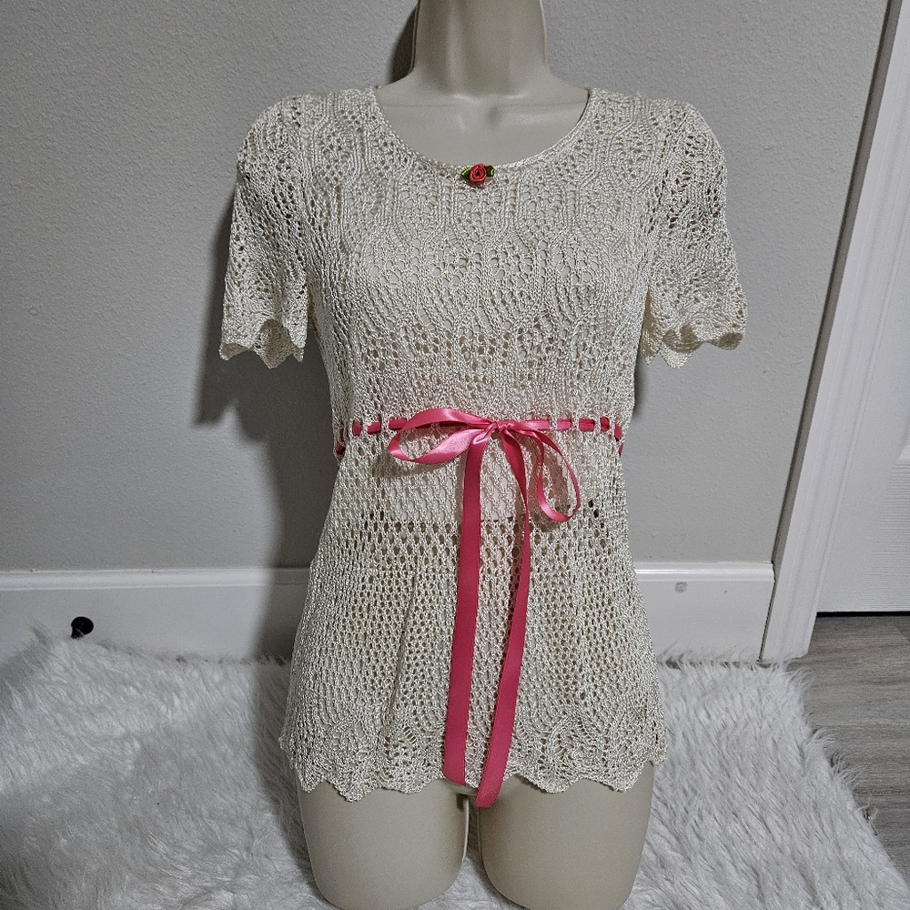 Elegant Cream Knit Top with Pink Accents